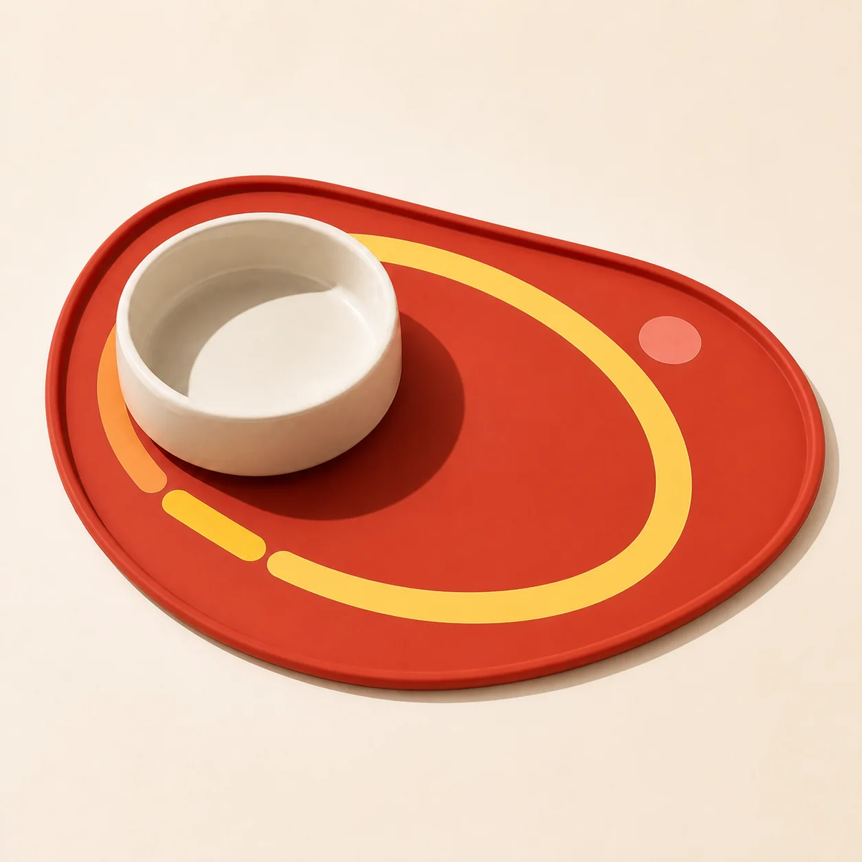 A navy Meow Dynamo cat feeding mat with an orbit graphic and a ceramic bowl